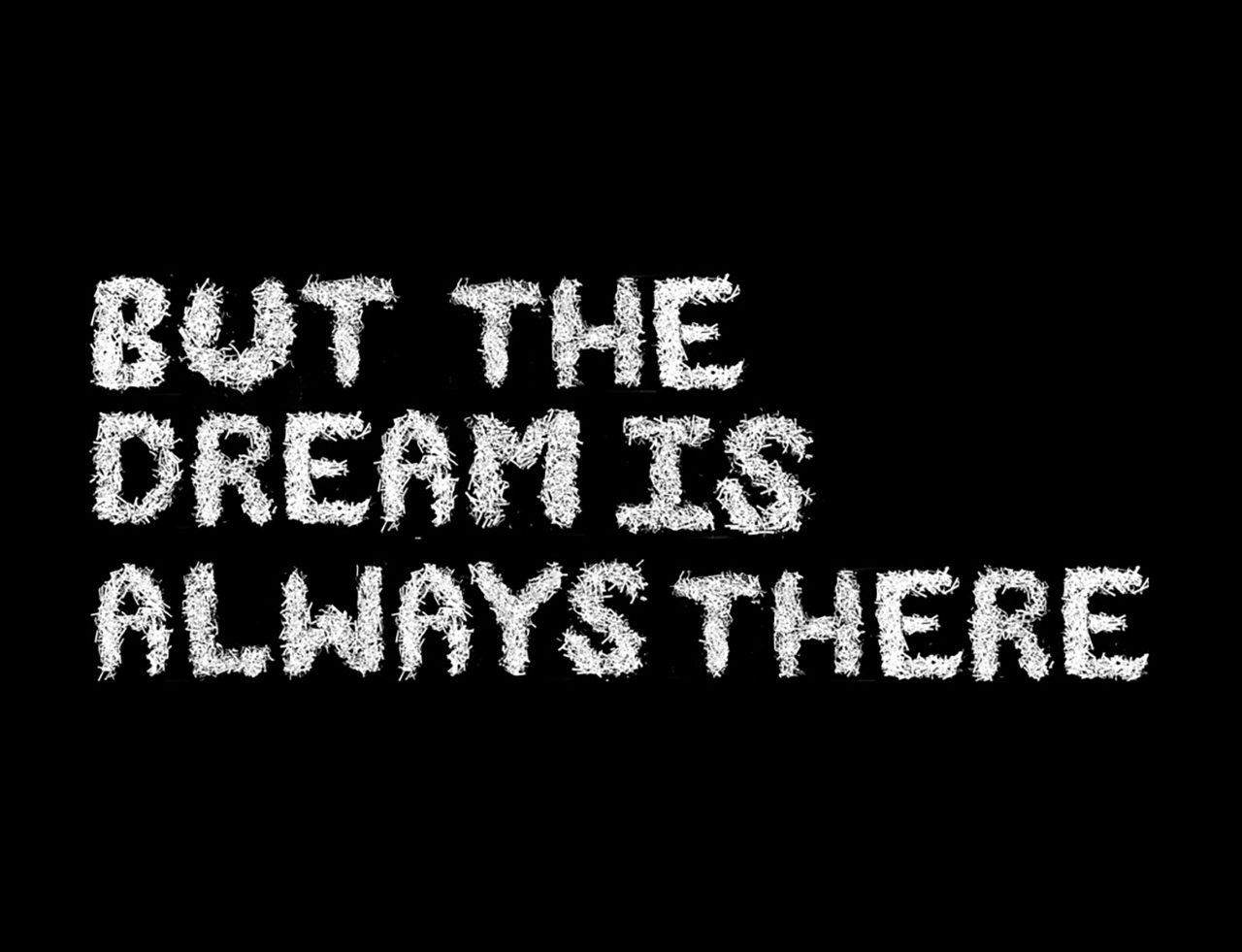 black image with white text reading but the dream is always there